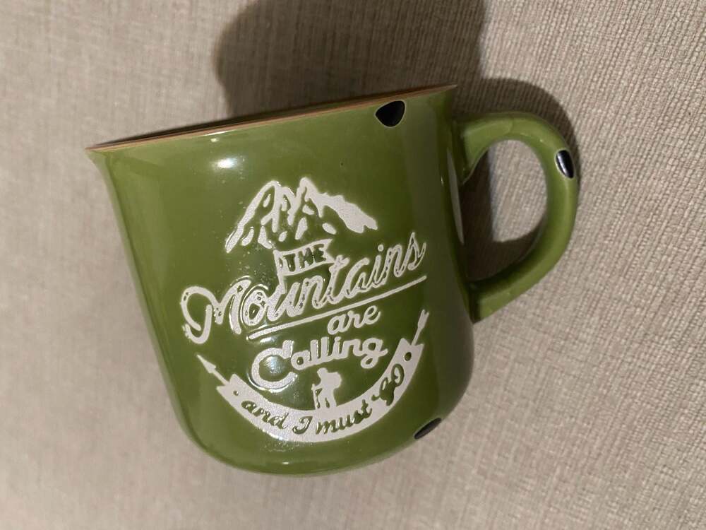 “The Mountains Are Calling" Green Speckled Ceramic Campfire Mug